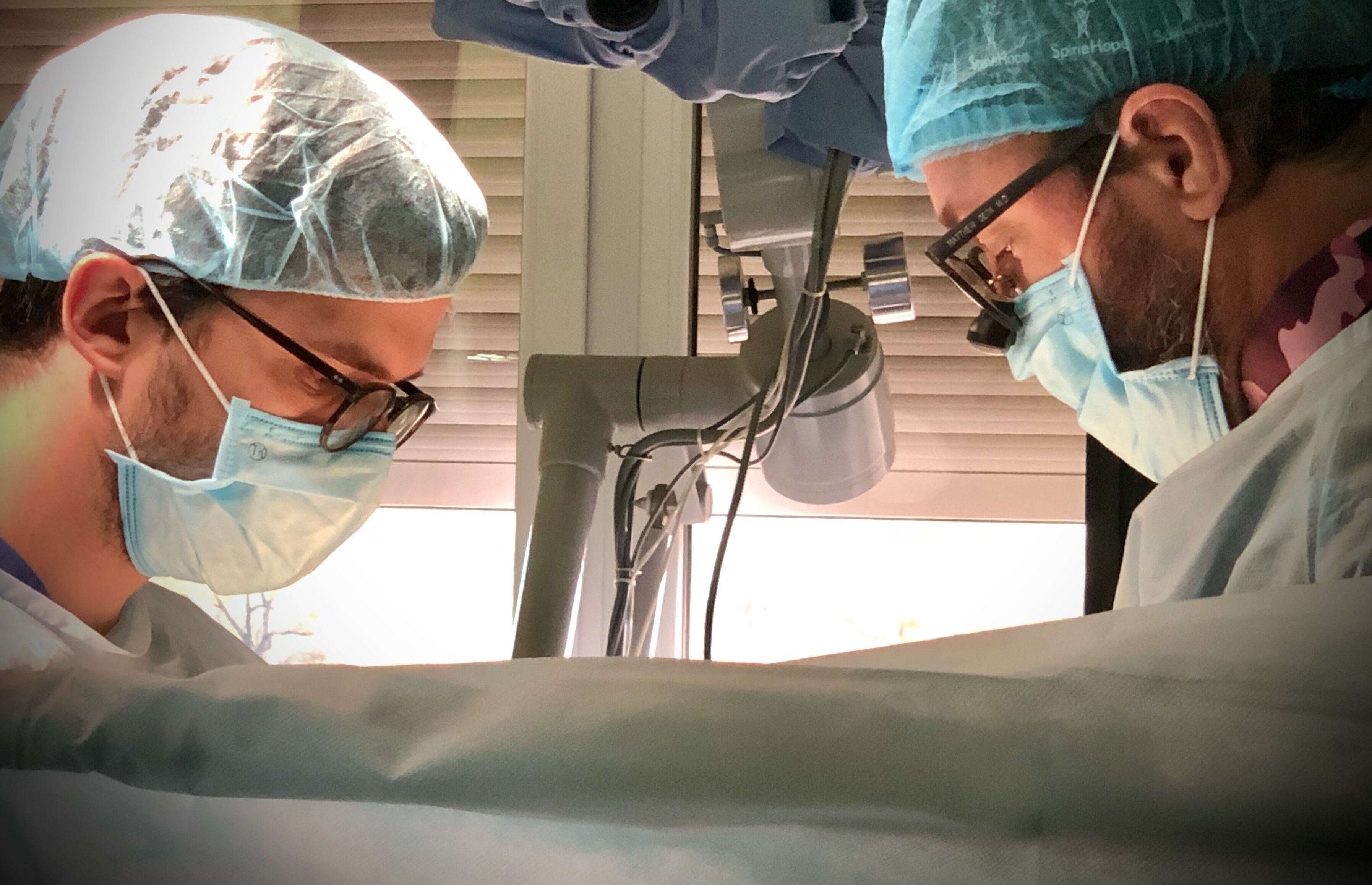 Two neurosurgeons performing epilepsy surgery