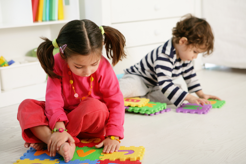 Two children solving puzzles